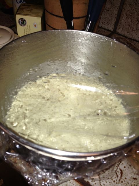 Risen bread in mixing bowl